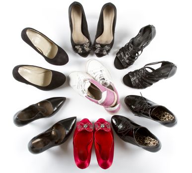 Several pairs of high heels in red and black