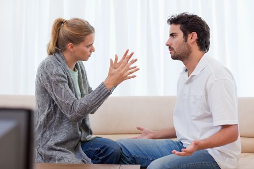 Woman being mad at her boyfriend in their living room