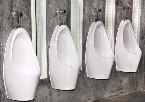 For urine white ceramic   sanitary ware in restroom.