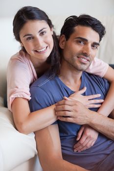 Portrait of a couple posing in their living room