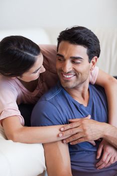 Portrait of a charming couple posing in their living room