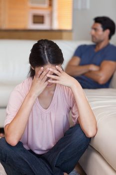 Portrait of a couple mad at each other in their living room