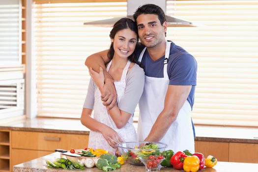 Charming young couple posing in their kitchen