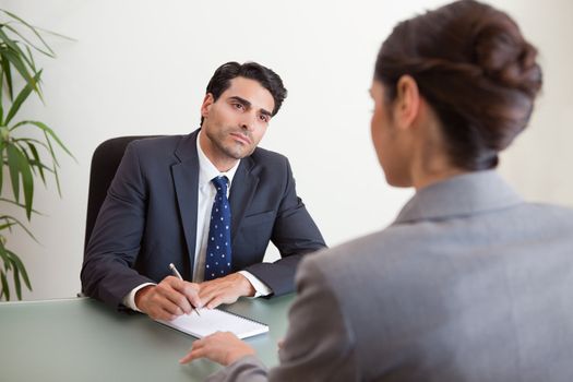 Young marketers having a brainstorming in a meeting room