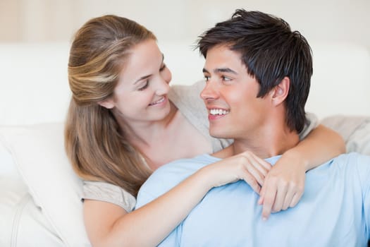 Close up of a charming couple posing in their living room