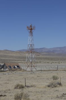 runway in the middle of the desert with a radar