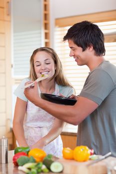 Portrait of a couple preparing dinner in their kitchen