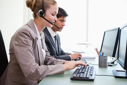 Operators working with computers in an office