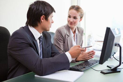 Business team working with a computer in an office