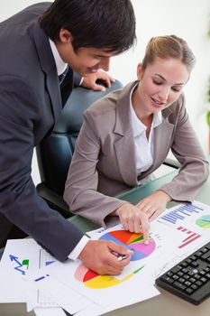 Portrait of a business team studying statistics in a meeting room