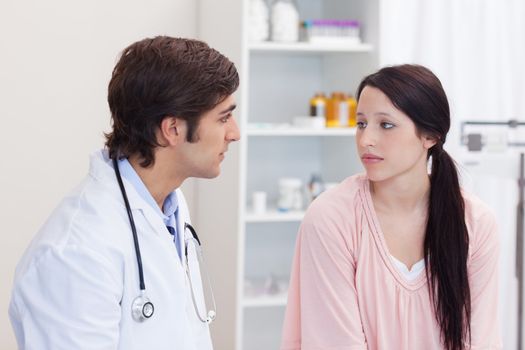 Male doctor talking with his patient