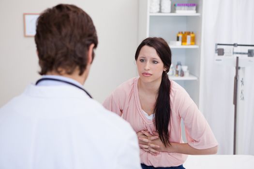 Male doctor talking with patient