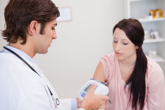 Female patient having her blood pressure checked