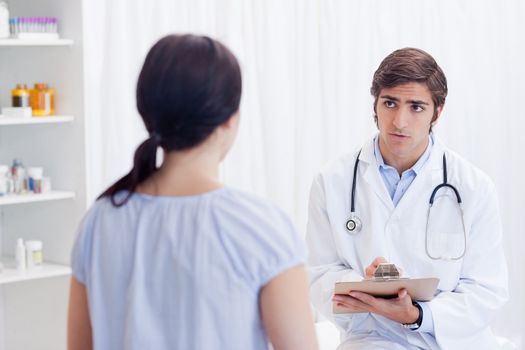 Male physician talking with patient