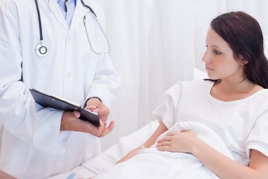 Female patient getting examination results explained