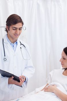 Young patient and doctor talking about examination results