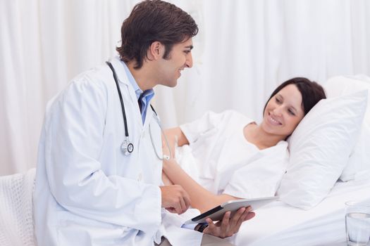 Young doctor telling his patient the good news