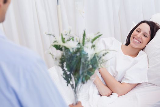 Young woman getting visited in hospital