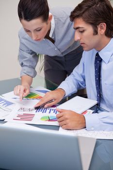 Young business team working on sales statistic