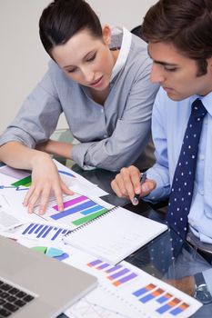 Young business team analyzing charts
