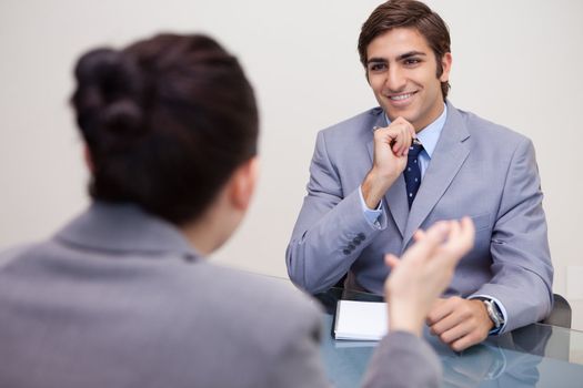 Smiling young businessman in a negotiation