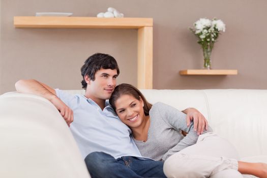 Young couple being together on the sofa