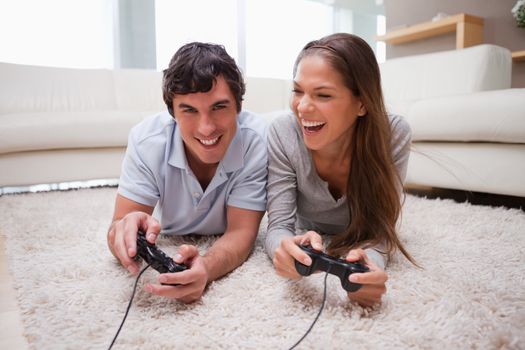 Young couple playing video games together