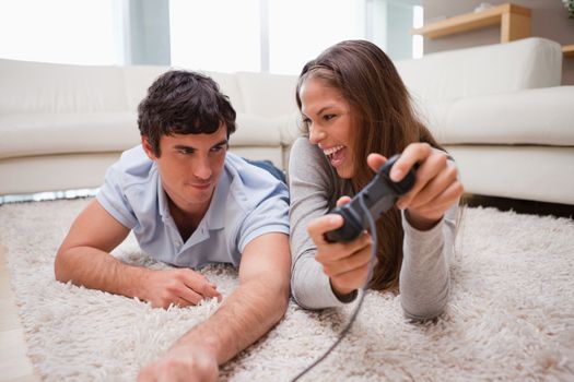 Young woman just defeated her boyfriend at a video game