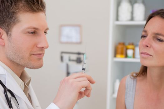 Doctor with syringe for patient