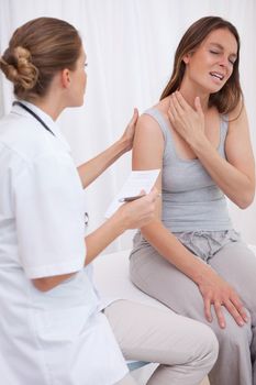 Patient showing painful spot to doctor