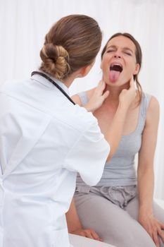 Patient showing tongue to doctor