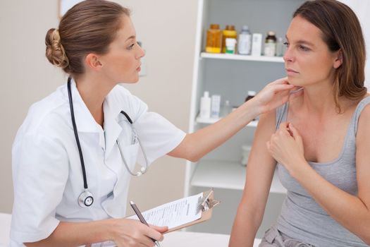 Patient being examined by doctor