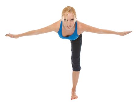 Practicing Yoga. Young woman isolated on white background