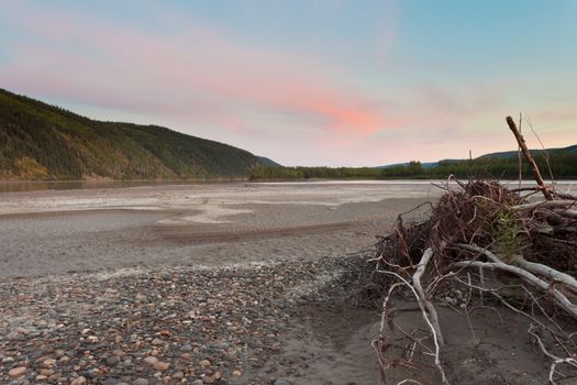 Sunset twilight over boreal forest at Yukon River, Canada