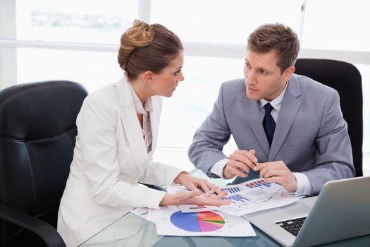Business team talking about market research results