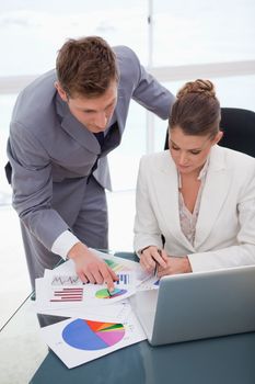 Business team analyzing survey results together