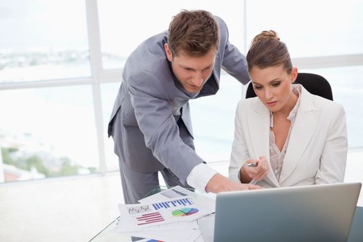 Business team working on poll results together