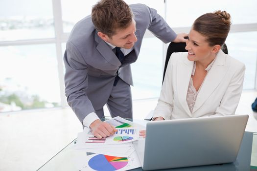 Business team analyzing poll results together