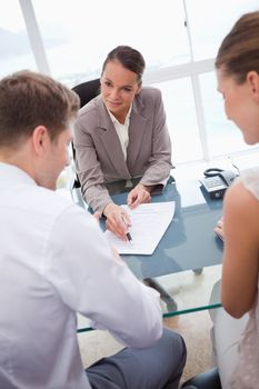 Businesswoman making an offer to negotiation partners