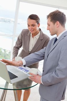 Market analyst talking with customer about research results