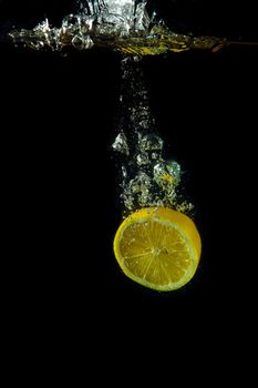 Bright and juicy lemon under water. Fresh and healthy meal