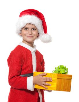 Boy holding a christmas gift isolated on white background