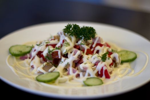 Mixed vegetables on  a plate against dark background