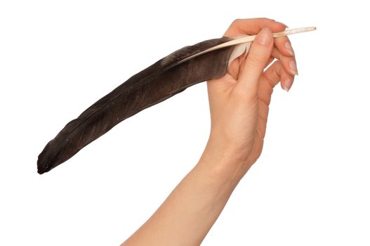 woman writing poem with a black feather