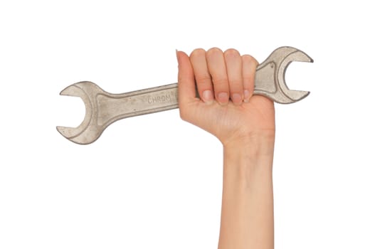 big spanner in the woman's hsand on white background