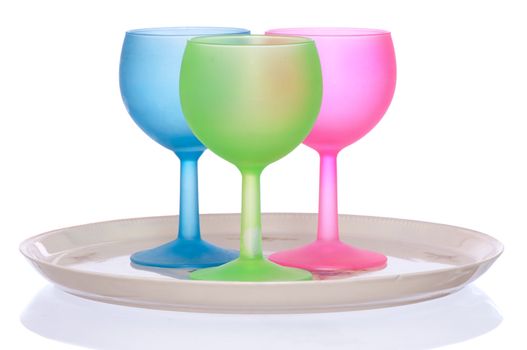 three colored wine glasses for cocktails on the tray for party