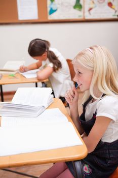 Portrait of pupils doing classwork in a classroom