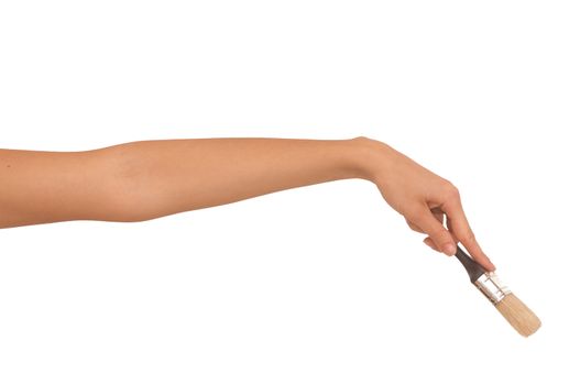 The woman draws the brush on the wall
