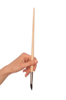 woman drawing a picture with a brush