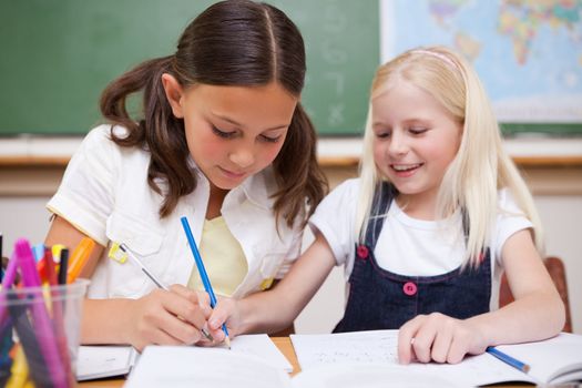 Pupils working together in a classroom